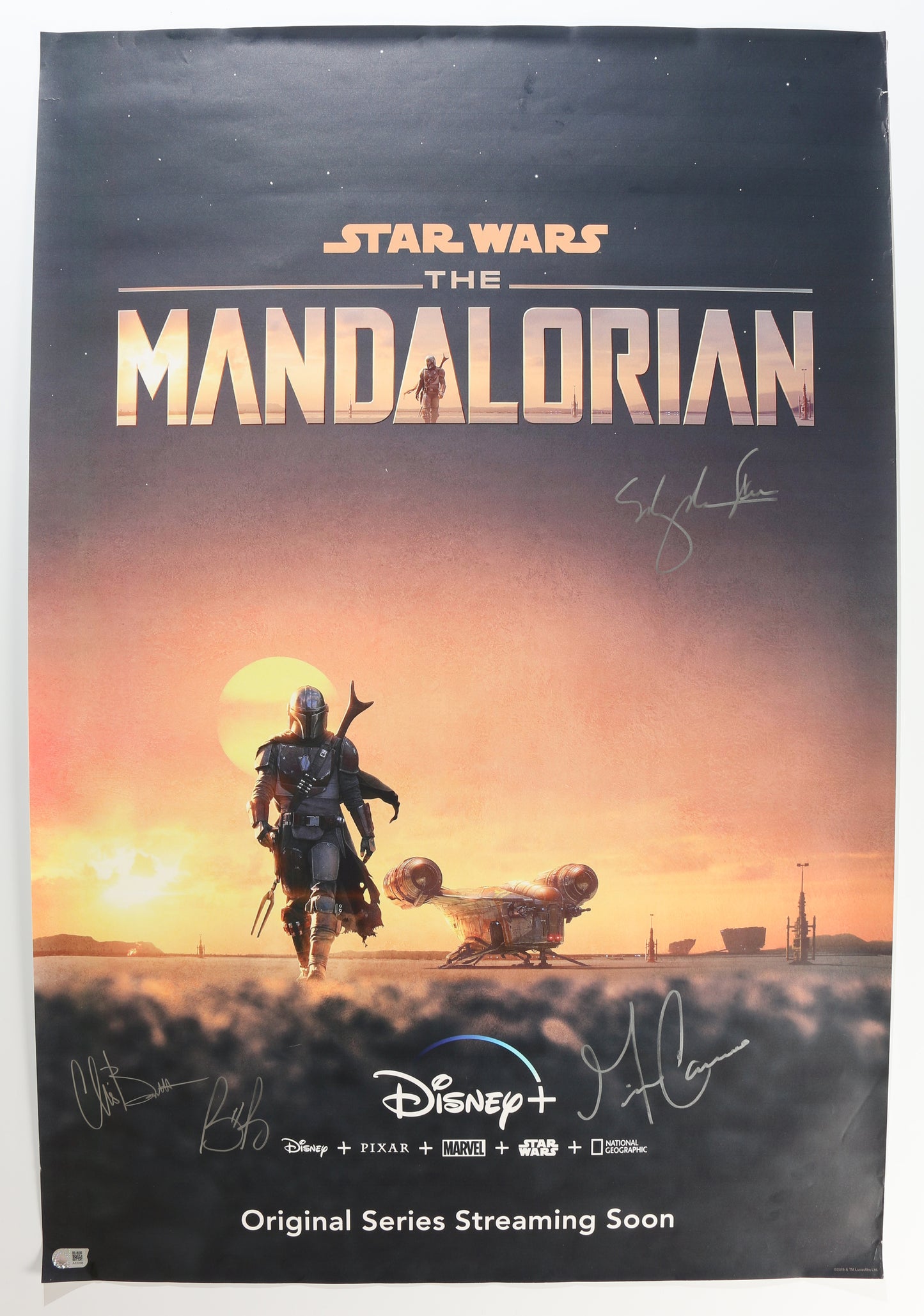 
                  
                    Star Wars: The Mandalorian 27x40 Poster (SWAU Witnessed) Cast Signed by Gina Carano, Bill Burr, Ming-Na Wen, & Chris Bartlett
                  
                
