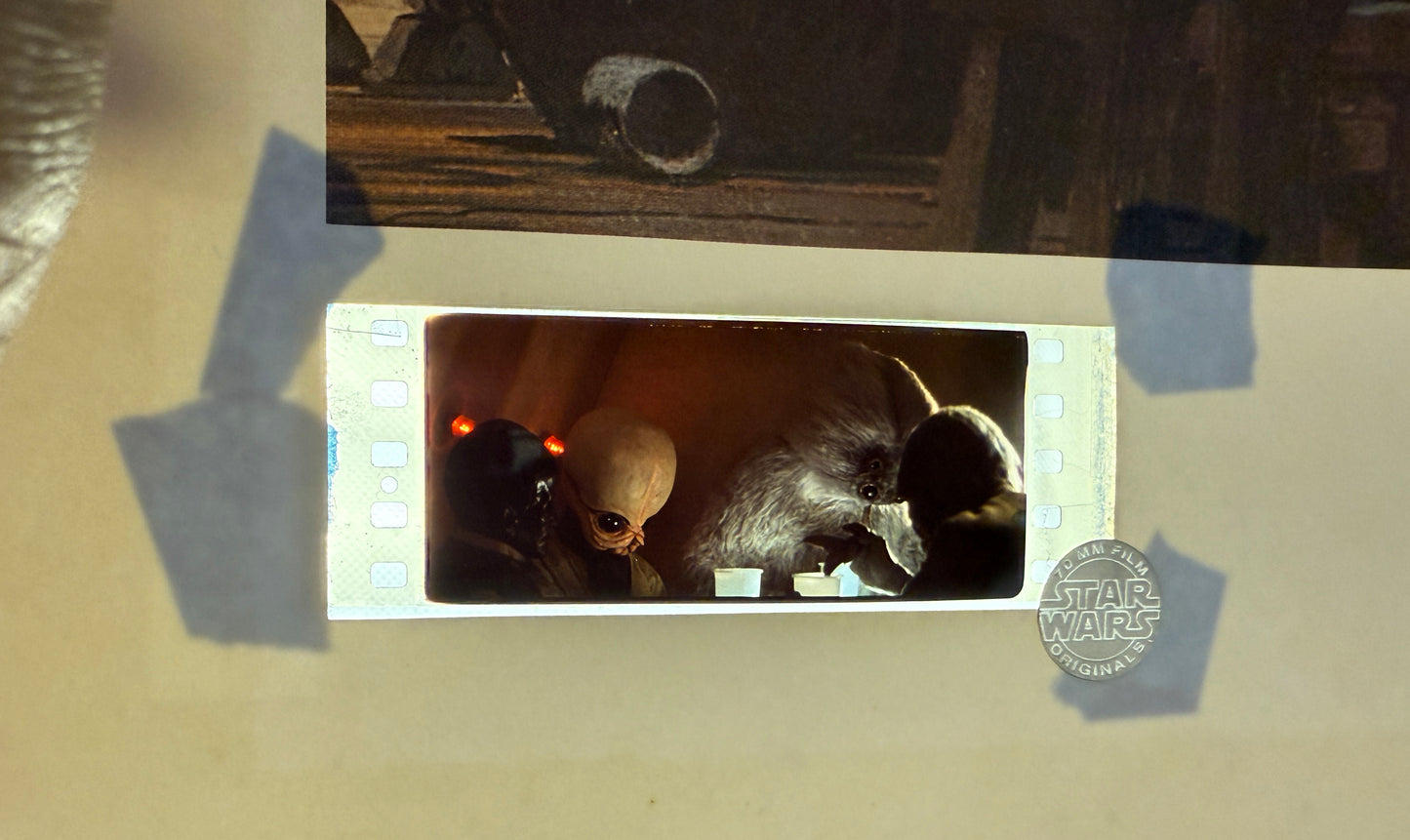 
                  
                    Star Wars: A New Hope The Cantina on Mos Eisley 12x18 Lithograph with Light Up Film Cel LE #50/2,500 Signed by Concept Artist Ralph McQuarrie
                  
                