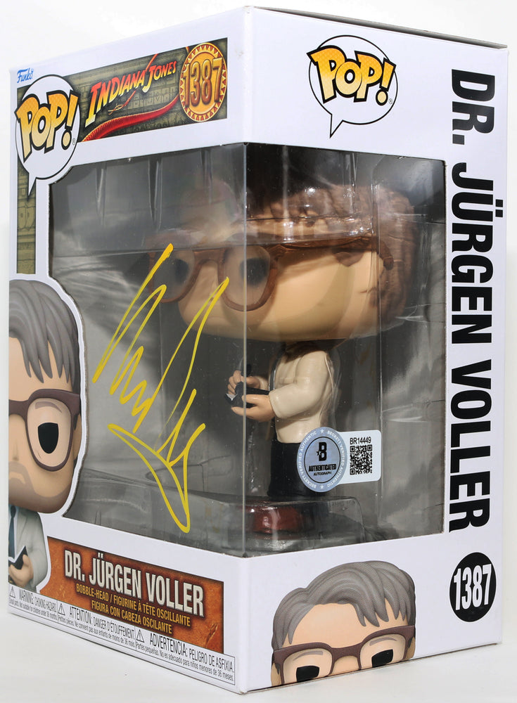 
                  
                    Mads Mikkelsen as Dr. Jürgen Voller in Indiana Jones & the Dial of Destiny (Beckett) Signed Funko POP! #1387
                  
                