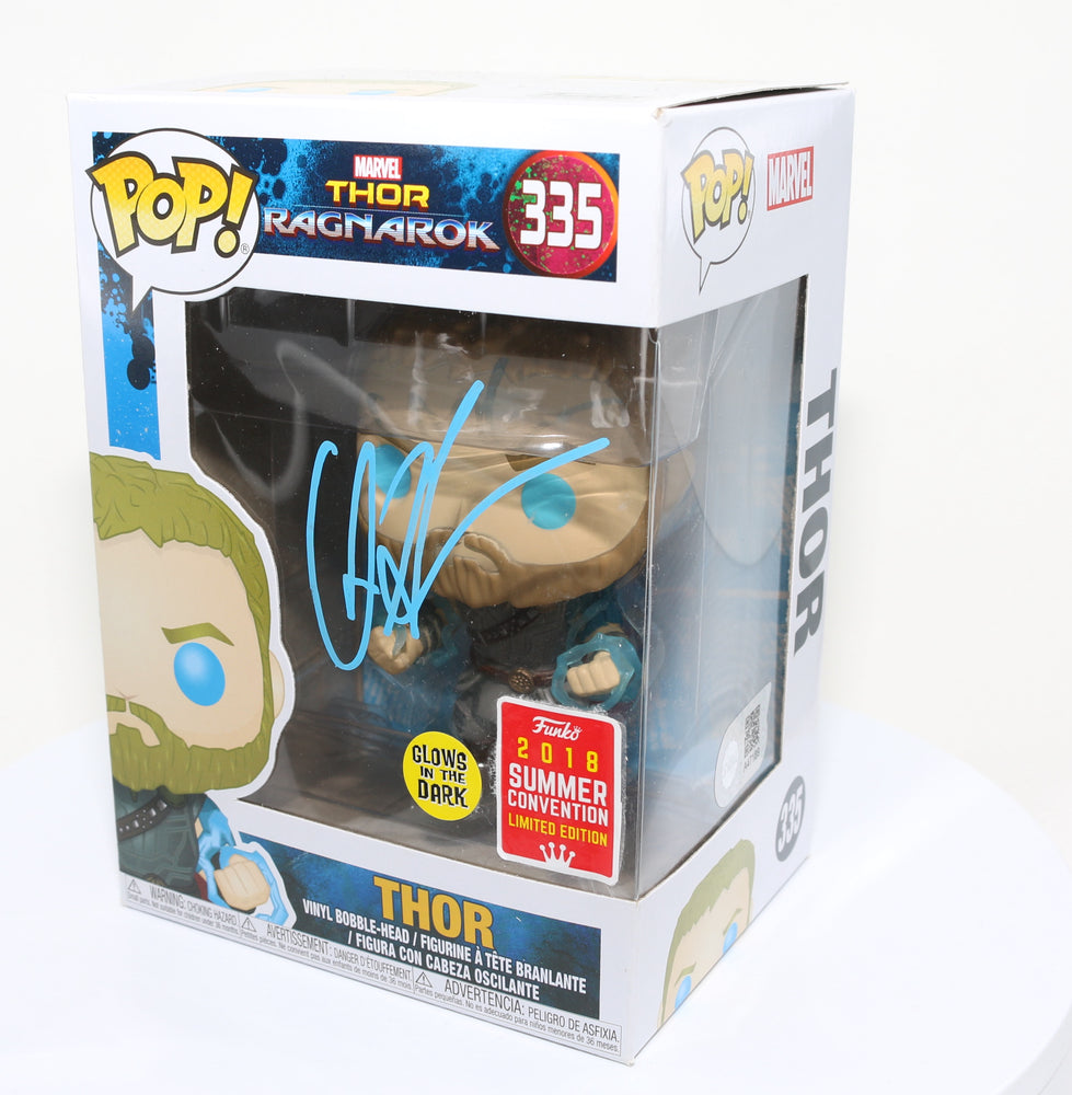 
                  
                    Chris Hemsworth as Thor in Thor: Ragnarok 2018 Summer Convention Glow in the Dark Exclusive (SWAU) Signed Funko POP! #335
                  
                