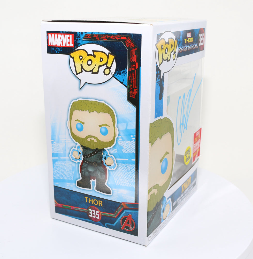 
                  
                    Chris Hemsworth as Thor in Thor: Ragnarok 2018 Summer Convention Glow in the Dark Exclusive (SWAU) Signed Funko POP! #335
                  
                