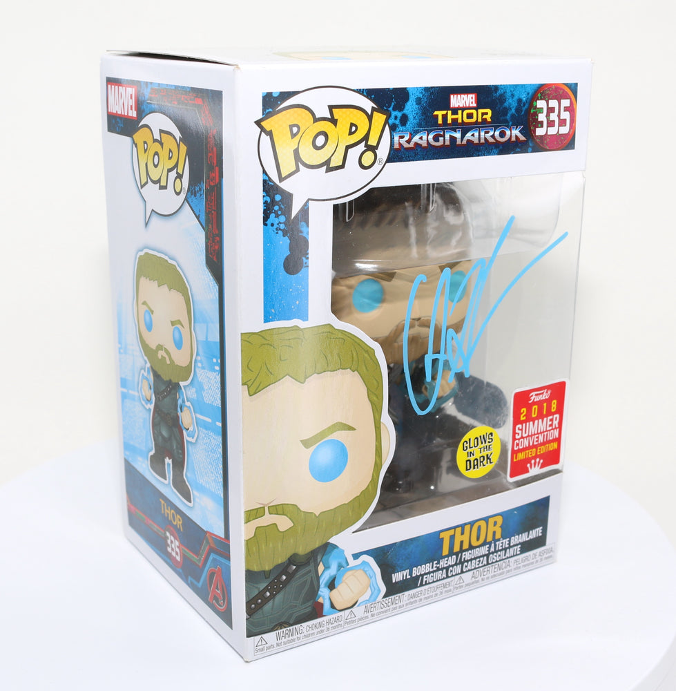 
                  
                    Chris Hemsworth as Thor in Thor: Ragnarok 2018 Summer Convention Glow in the Dark Exclusive (SWAU) Signed Funko POP! #335
                  
                