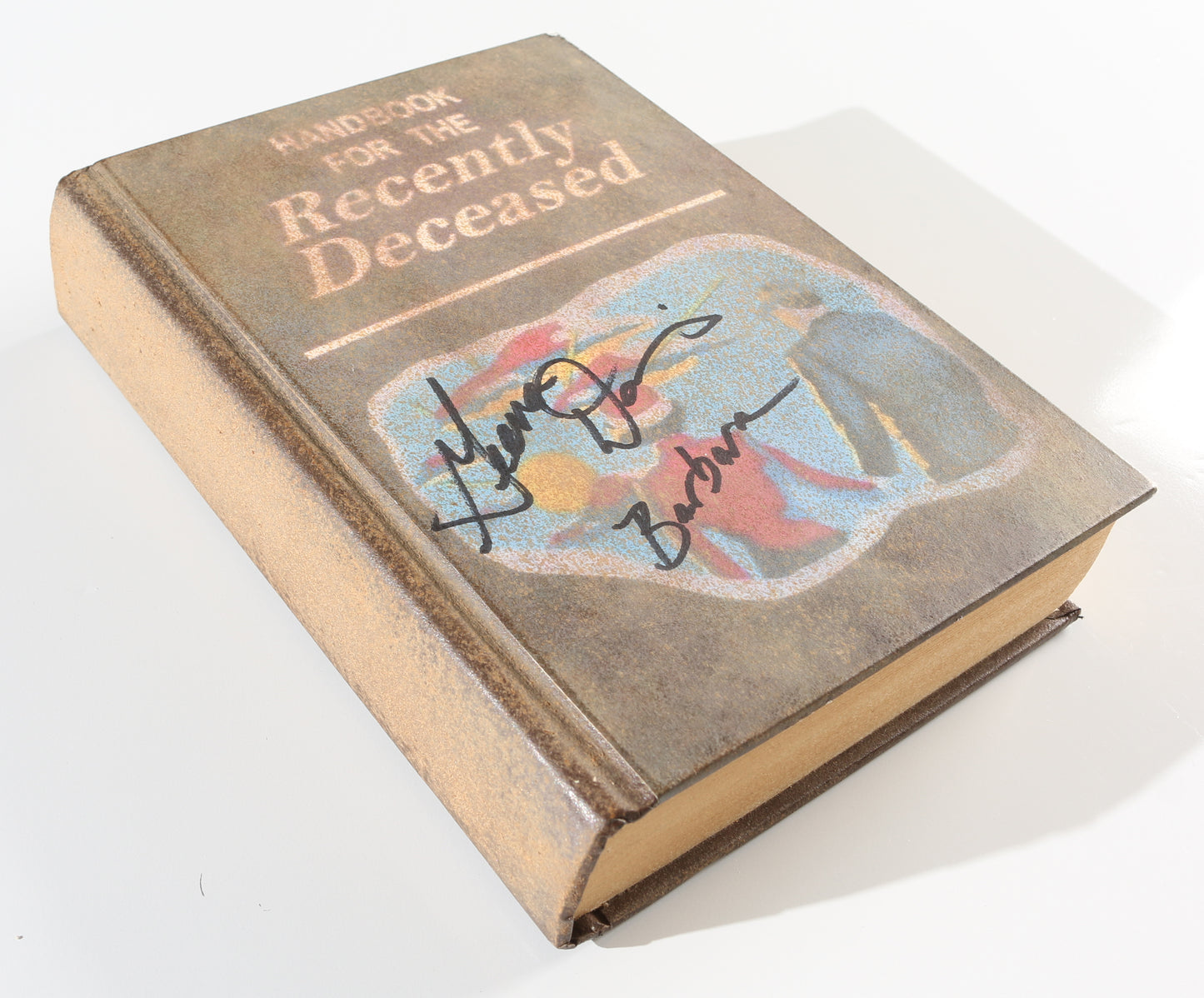 
                  
                    Geena Davis as Barbara Maitland in Tim Burton's Beetlejuice Signed Prop Replica Handbook for the Recently Deceased
                  
                