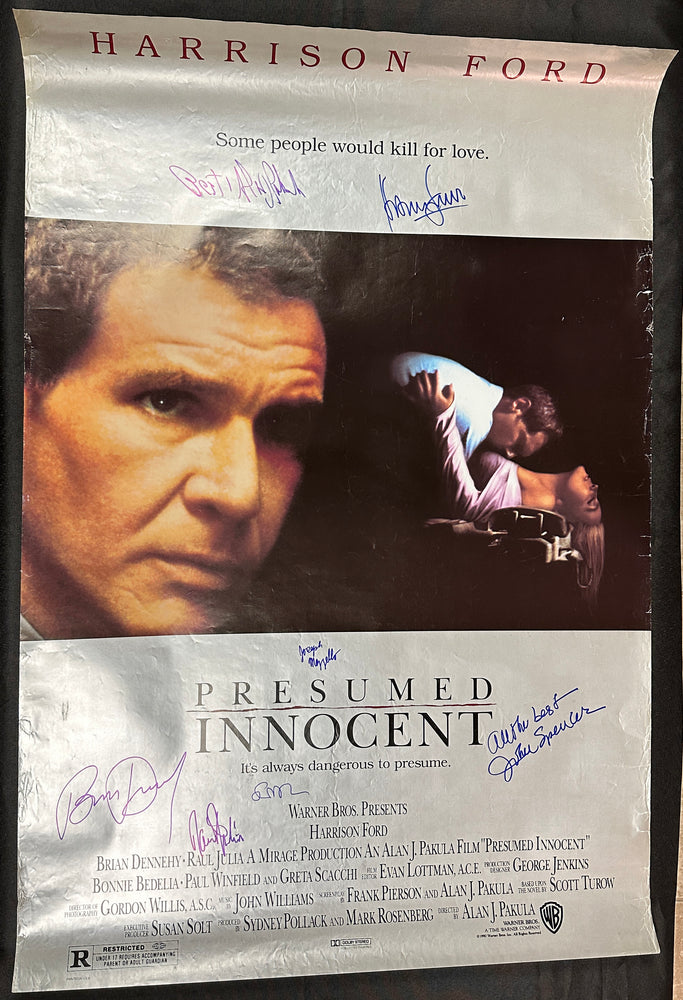 
                  
                    Presumed Innocent 27x40 Poster Cast Signed by Harrison Ford, Raul Julia, Director Alan J. Pakula, Brian Dennehy, & More
                  
                