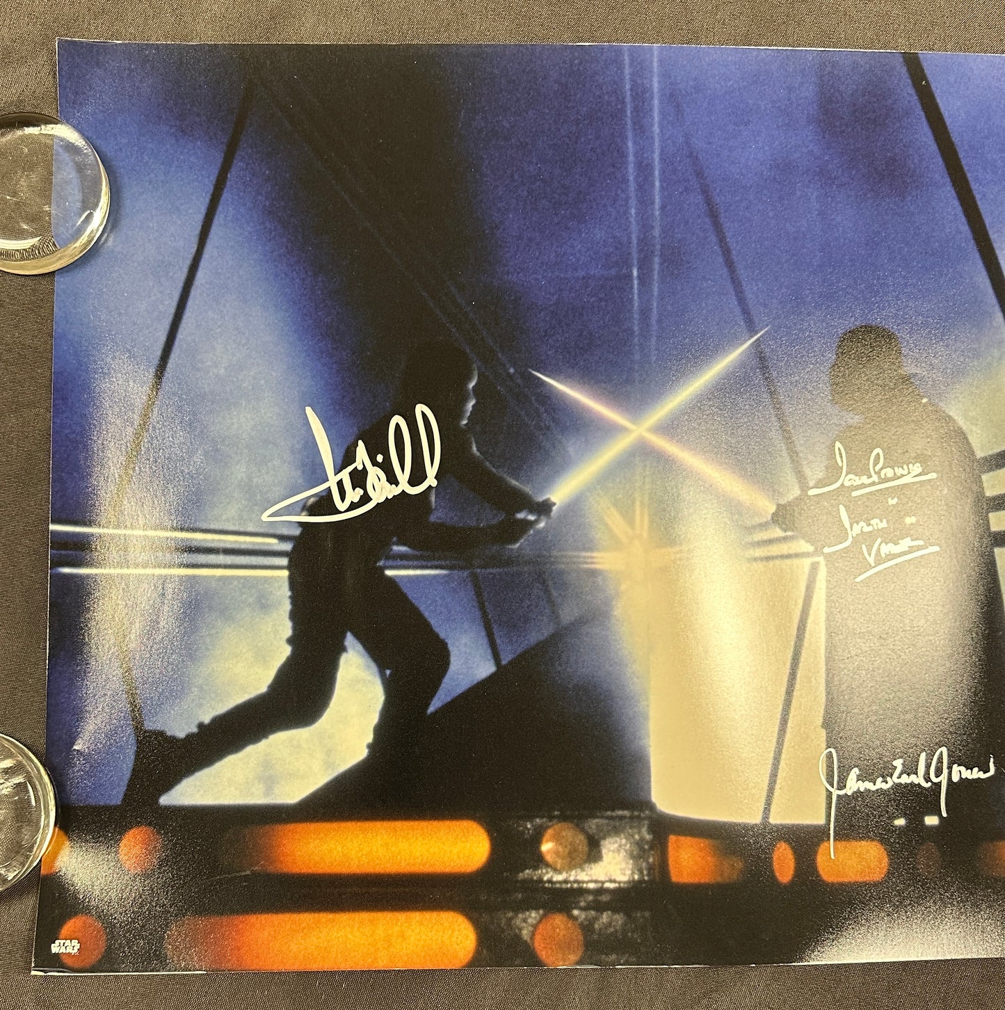 
                  
                    Mark Hamill as Luke Skywalker vs. James Earl Jones & Dave Prowse as Darth Vader Lightsaber Duel in Star Wars: The Empire Strikes Back Signed 16x20 Photo
                  
                