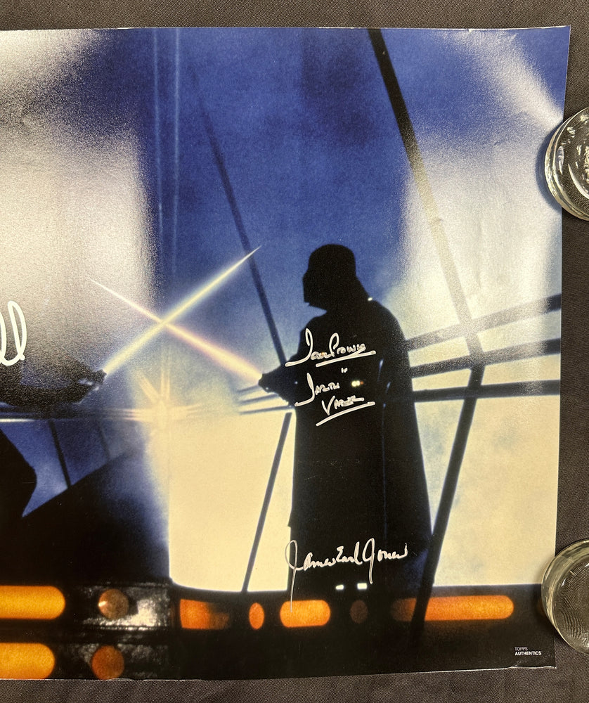 
                  
                    Mark Hamill as Luke Skywalker vs. James Earl Jones & Dave Prowse as Darth Vader Lightsaber Duel in Star Wars: The Empire Strikes Back Signed 16x20 Photo
                  
                