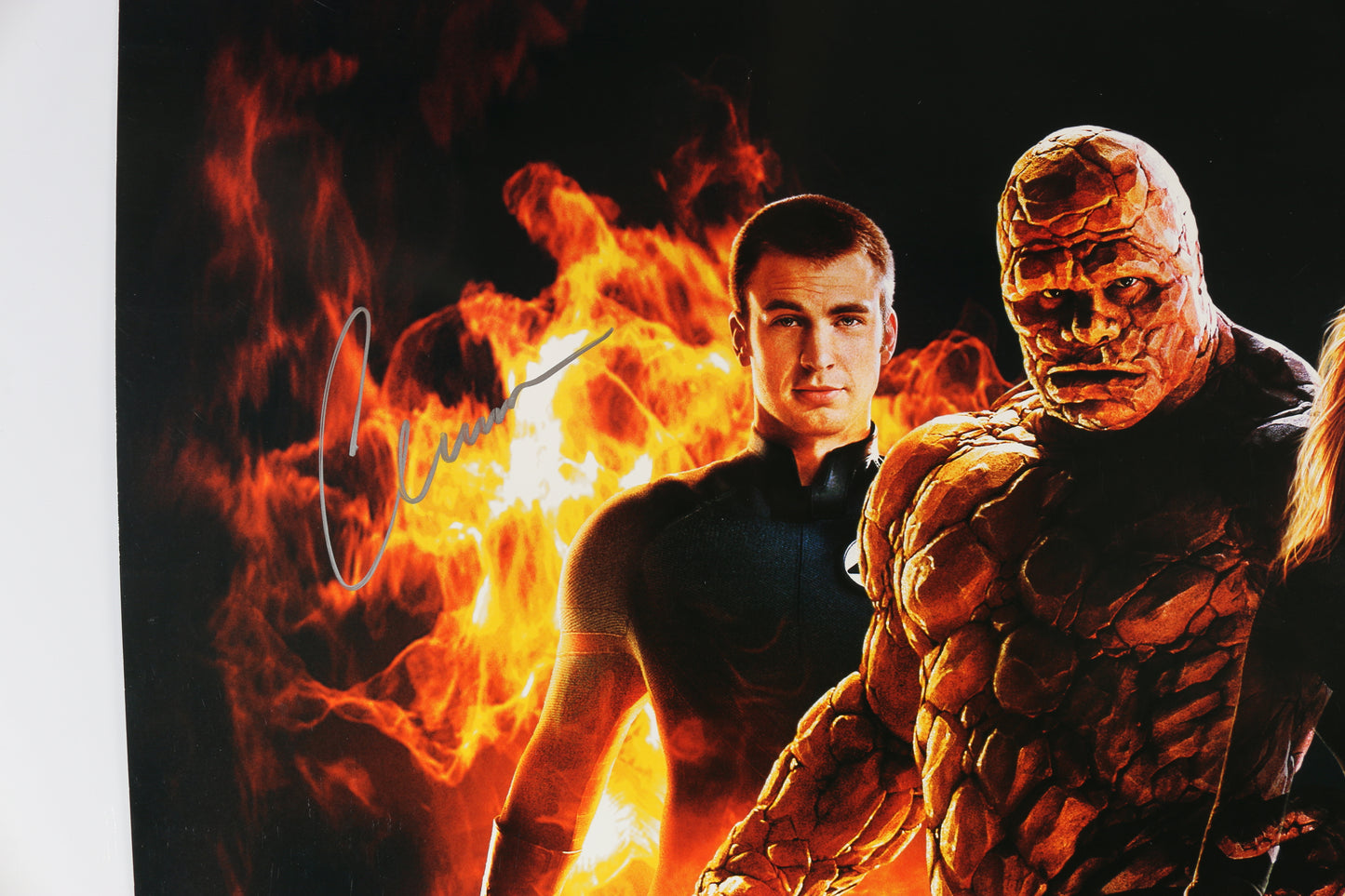 
                  
                    Chris Evans as Johnny Storm / Human Torch, Ioan Gruffudd as Reed Richards Mr. Fantastic, & Michael Chiklis as Ben Grimm / The Thing in Fantastic Four Signed 27x40 Poster with Character Names & Quotes
                  
                