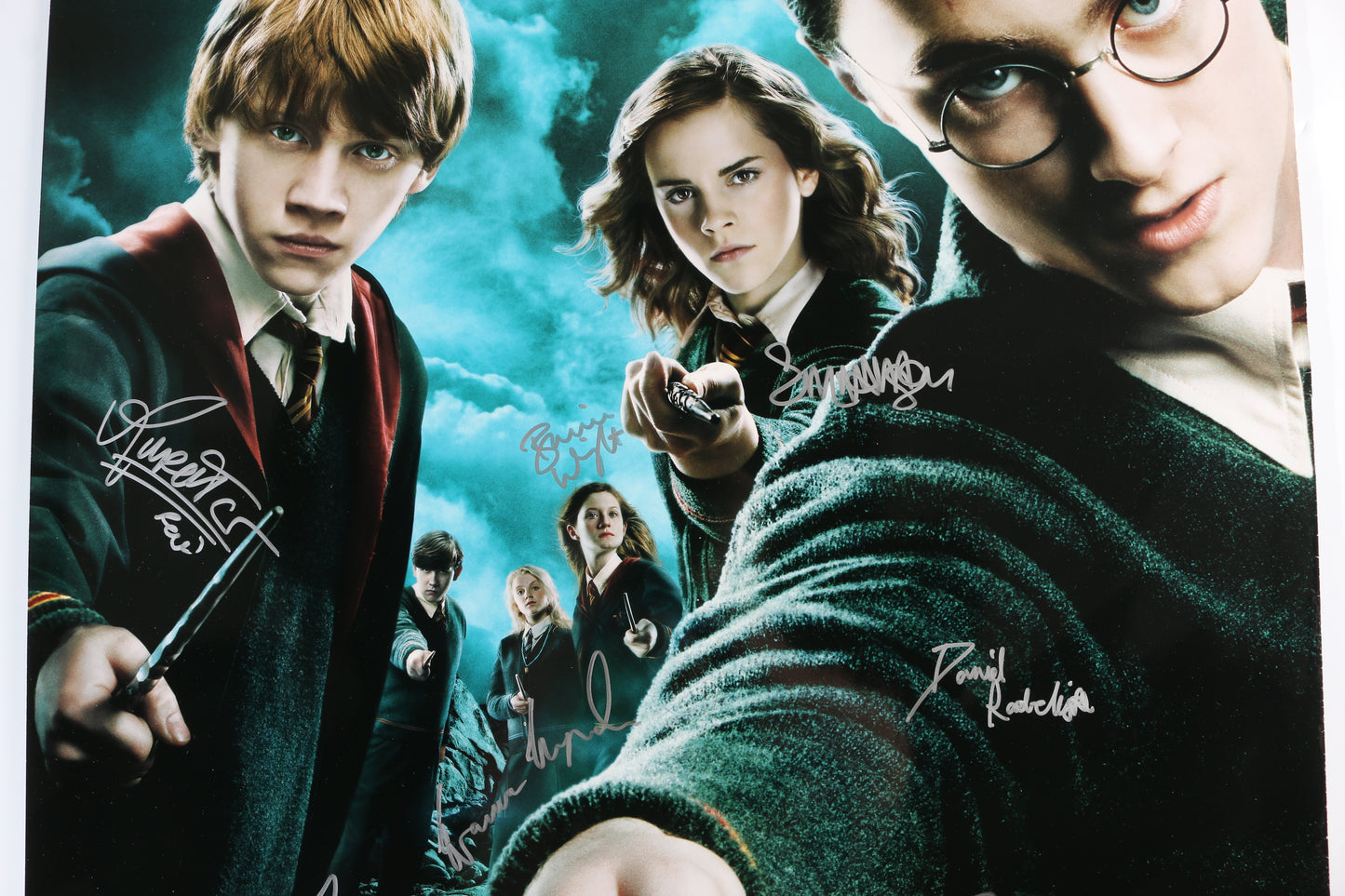
                  
                    Harry Potter & the Order of the Phoenix 27x40 Poster Cast Signed by Daniel Radcliffe, Emma Watson, Rupert Grint, Katie Leung, Matthew Lewis, Evanna Lynch, Imelda Staunton, Bonnie Wright, & Director: David Yates
                  
                