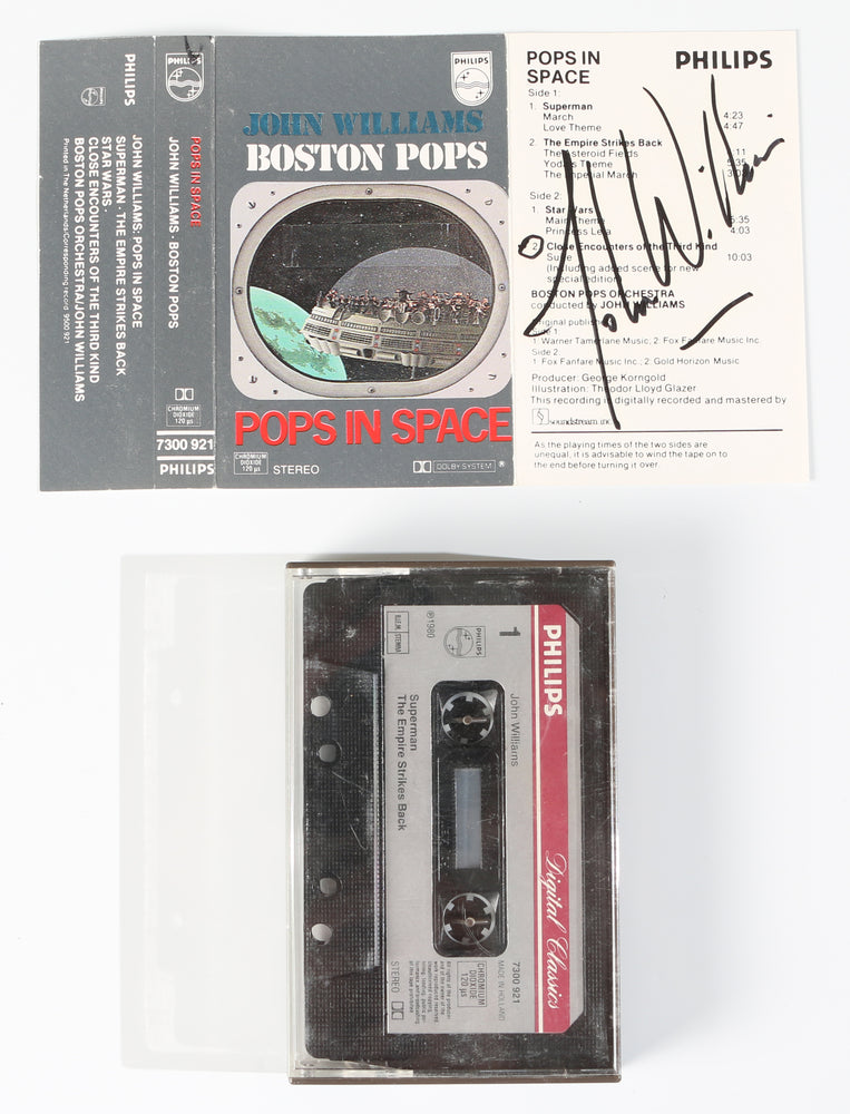 
                  
                    John Williams Composer of Star Wars, Indiana Jones, Superman, Harry Potter, Jurassic Park, Jaws, & More Signed Boston Pops in Space Signed Cassette Tape Cover
                  
                
