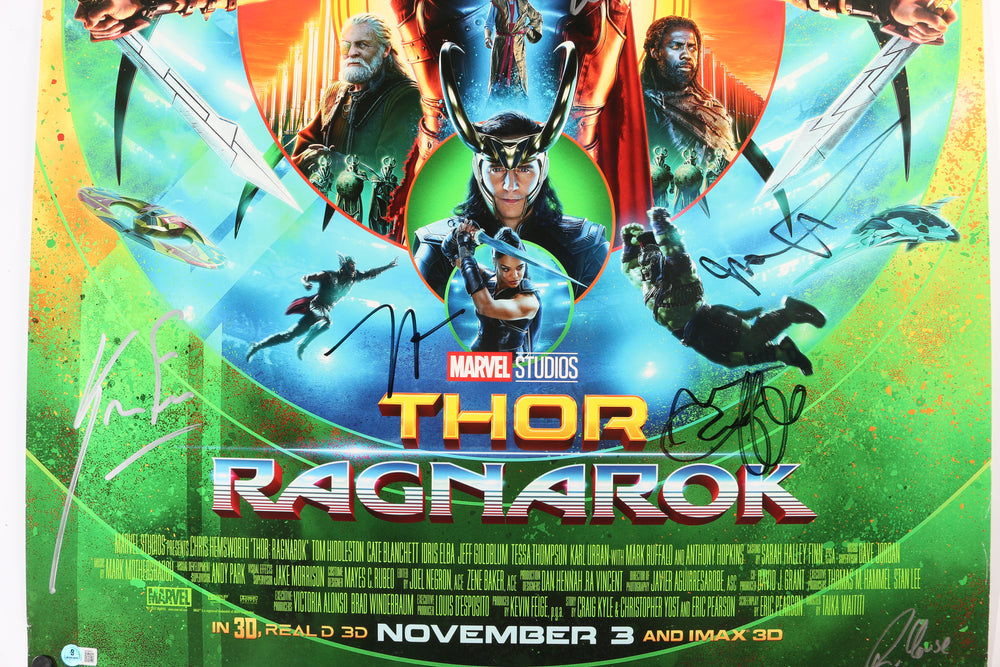 
                  
                    Thor: Ragnarok 27x40 Poster (Beckett) Cast Signed by Chris Hemsworth, Mark Ruffalo, Jeff Goldblum, Karl Urban, Producer: Kevin Feige, & Director: Taika Waititi
                  
                