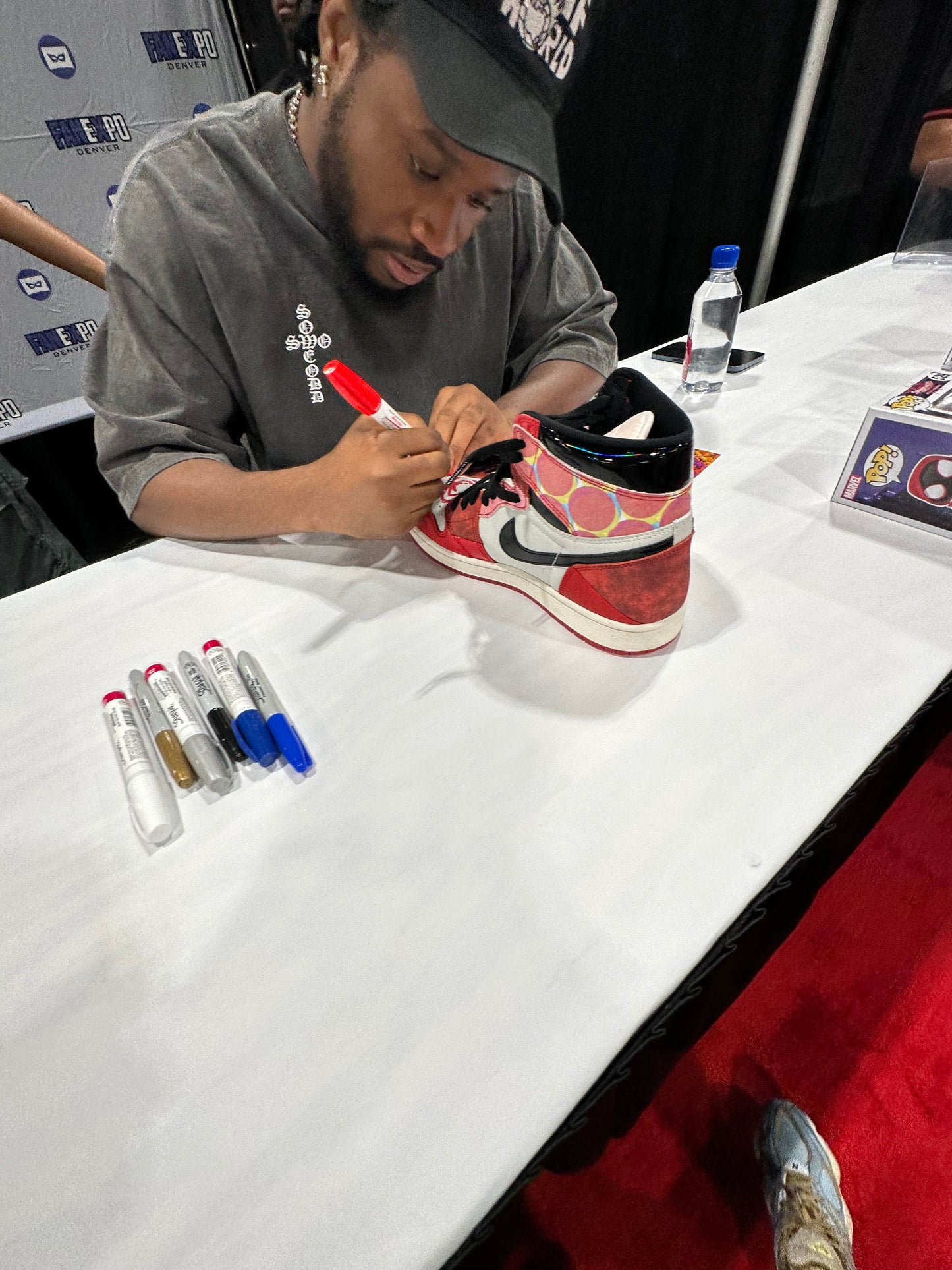 
                  
                    Shameik Moore as Miles Morales / Spider-Man in Spider-Man: Across the Spider-Verse Signed Nike Jordan 1 Retro High OG Sneakers with Drawing & Quote
                  
                