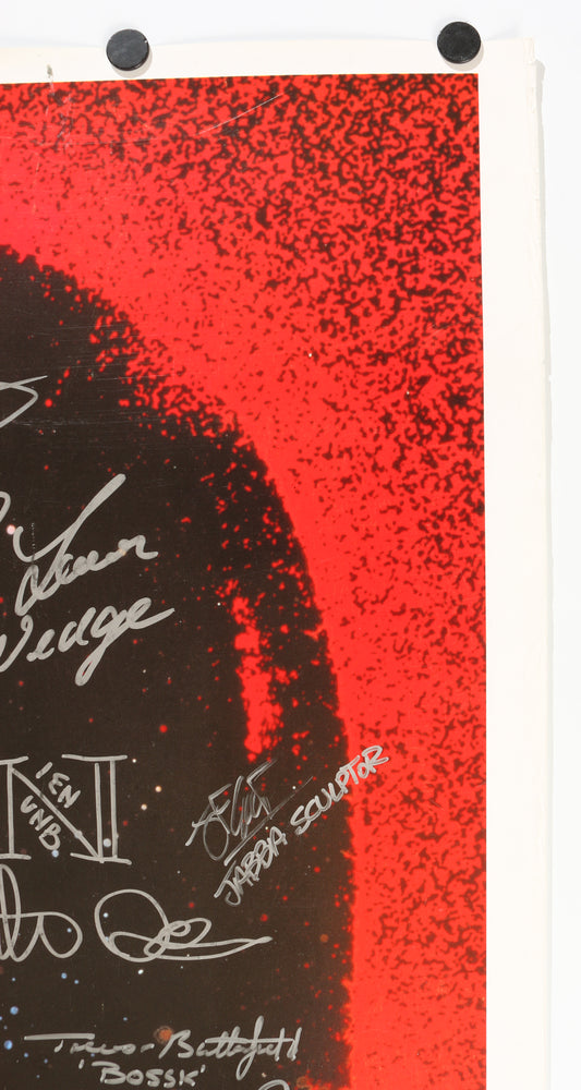 
                  
                    Star Wars: Return of the Jedi 27x40 Poster Cast Signed by Harrison Ford, Carrie Fisher,  Mark Hamill, lan McDiarmid, Anthony Daniels, Bob Anderson, Dave Prowse, Peter Mayhew, Jeremy Bulloch, & More
                  
                