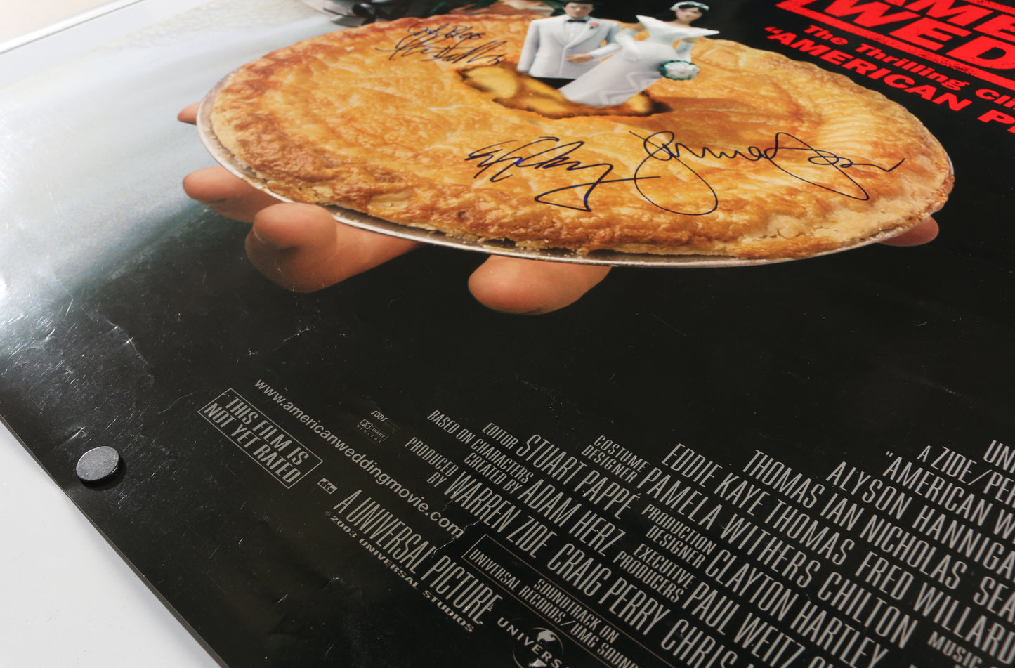 
                  
                    American Wedding 27x40 Poster Cast Signed by Jason Biggs, Alyson Hannigan, Seann William Scott, Eddie Kaye Thomas, Eugene Levy, Thomas Ian Nicholas, & January Jones
                  
                