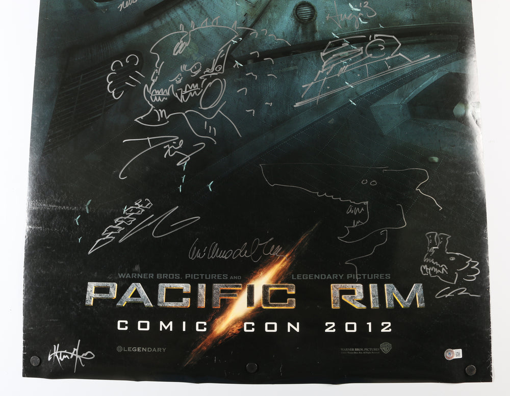 
                  
                    Pacific Rim 27x39.5 Poster Cast Signed by Director Guillermo Del Toro with Sketch Art, Hugo Martin, David Meng, Charlie Hunnam, Ron Perlman, Robin Thomas, John Giang, Guy Davis, John Rosengrant, Trevor Hensley, Nelson Hall, & Kevin Kutchaver
                  
                