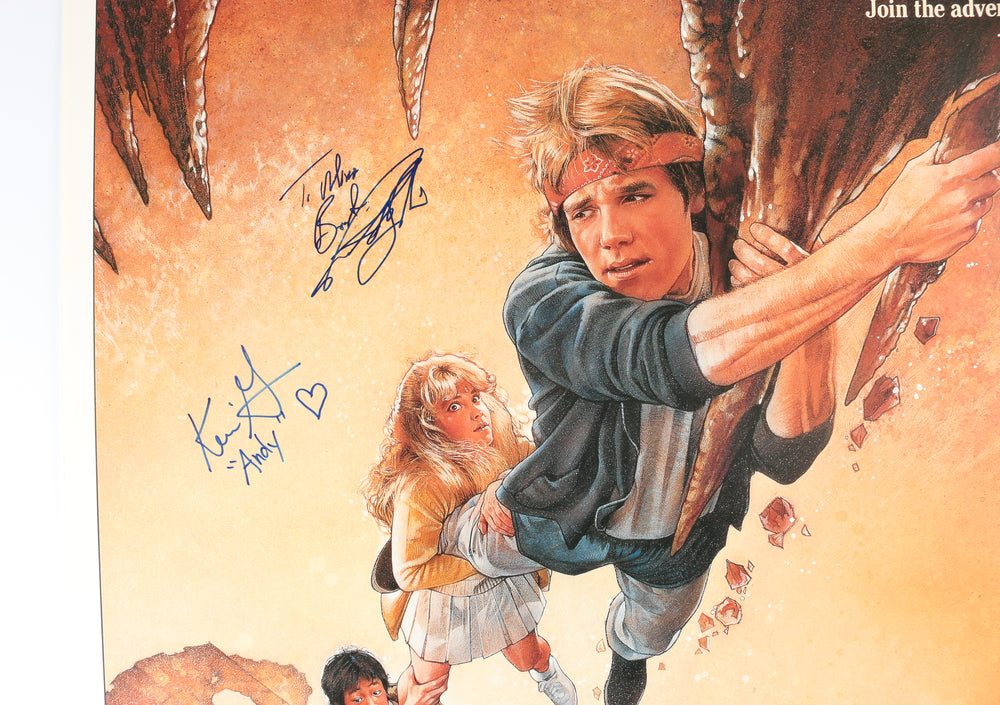 
                  
                    The Goonies 27x40 Poster Cast Signed by Sean Astin, Josh Brolin, Martha Plimpton, Kerri Green, Ted Grossman, and Director: Richard Donner
                  
                