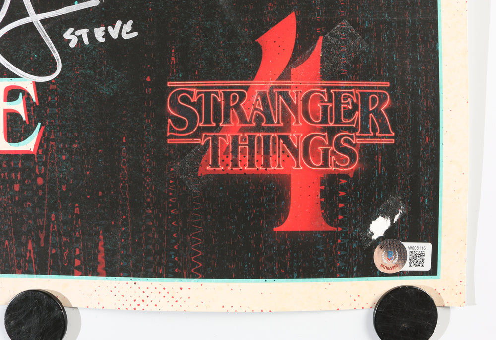 
                  
                    Stranger Things (Beckett) 24x36 Poster Cast Signed by Sadie Sink, Natalia Dyer, Joe Keery, Eduardo Franco, Gaten Matarazzo, Grace Van Dien, Priah Ferguson, & Winona Ryder with Character Names
                  
                