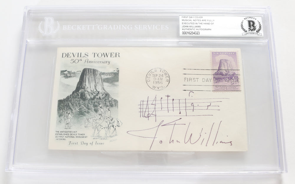 John Williams Composer Signed 6.5x3.5 First Day of Issue Envelope of Devil's Tower (Beckett Slabbed) with Rare AMQS Handwritten Musical Notes of the Close Encounters of the Third Kind Theme