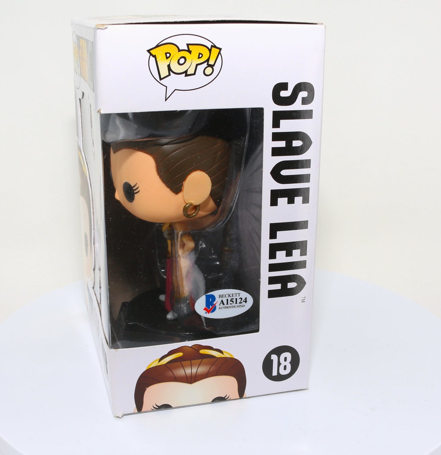 
                  
                    Carrie Fisher as Slave Princess Leia in Star Wars: Return of the Jedi (Radtke) Signed Funko POP! #18
                  
                