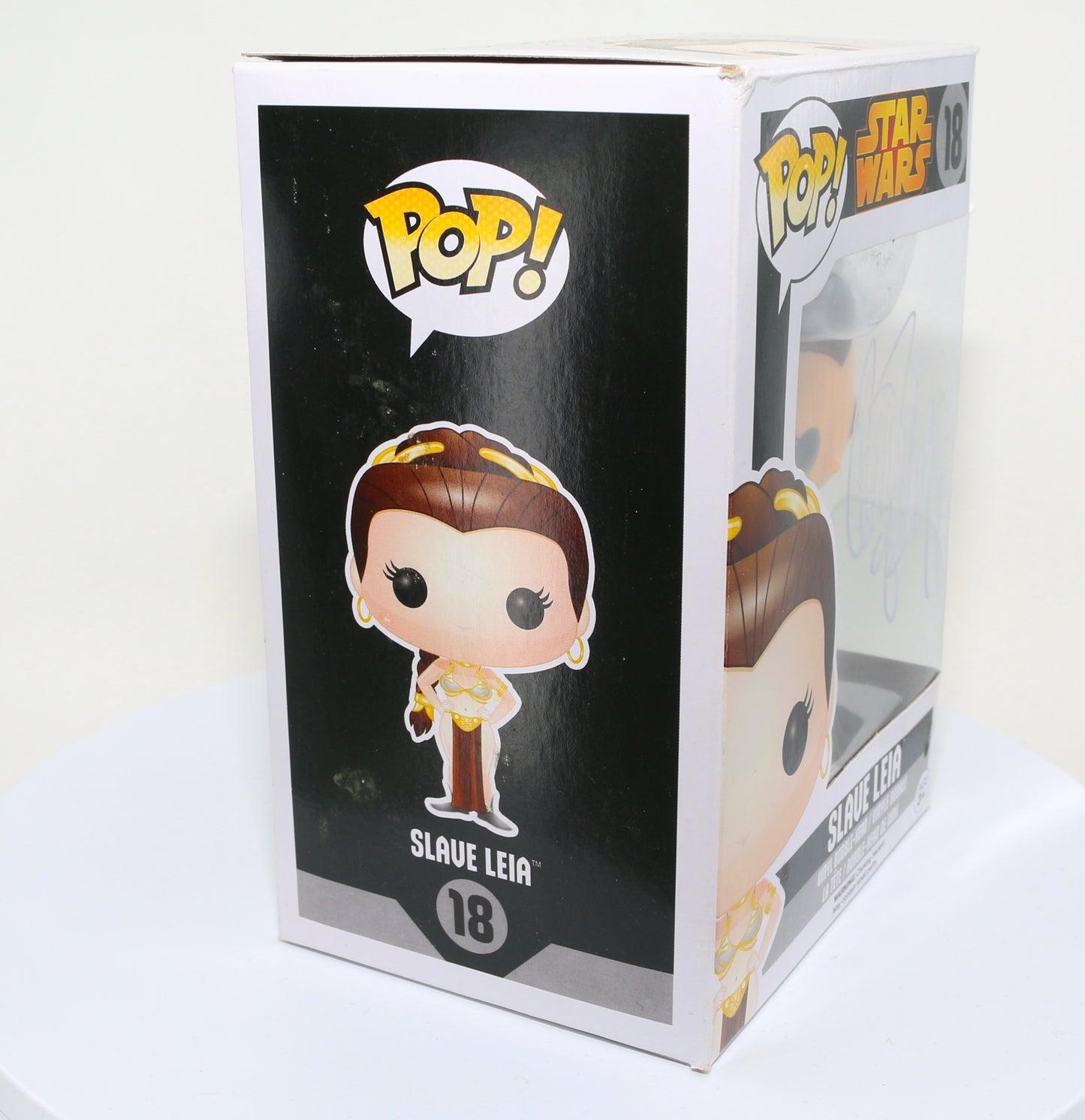 
                  
                    Carrie Fisher as Slave Princess Leia in Star Wars: Return of the Jedi (Radtke) Signed Funko POP! #18
                  
                