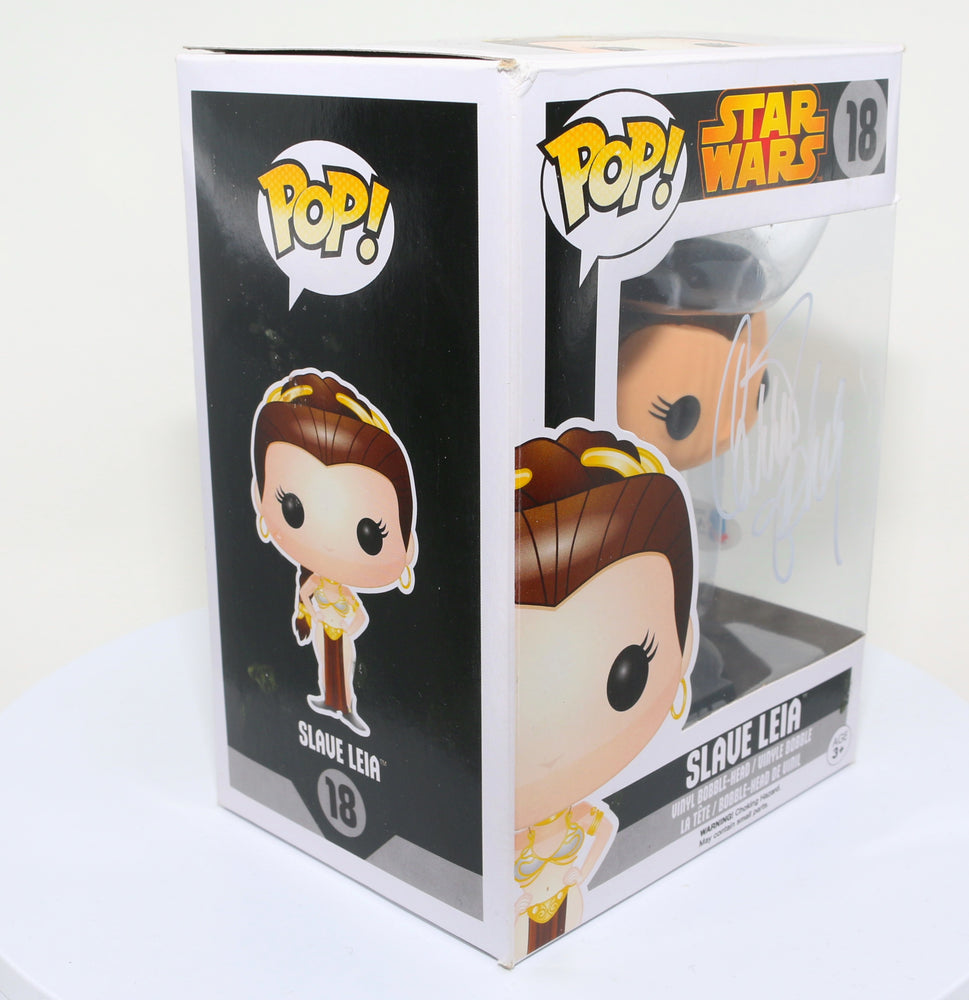 
                  
                    Carrie Fisher as Slave Princess Leia in Star Wars: Return of the Jedi (Radtke) Signed Funko POP! #18
                  
                