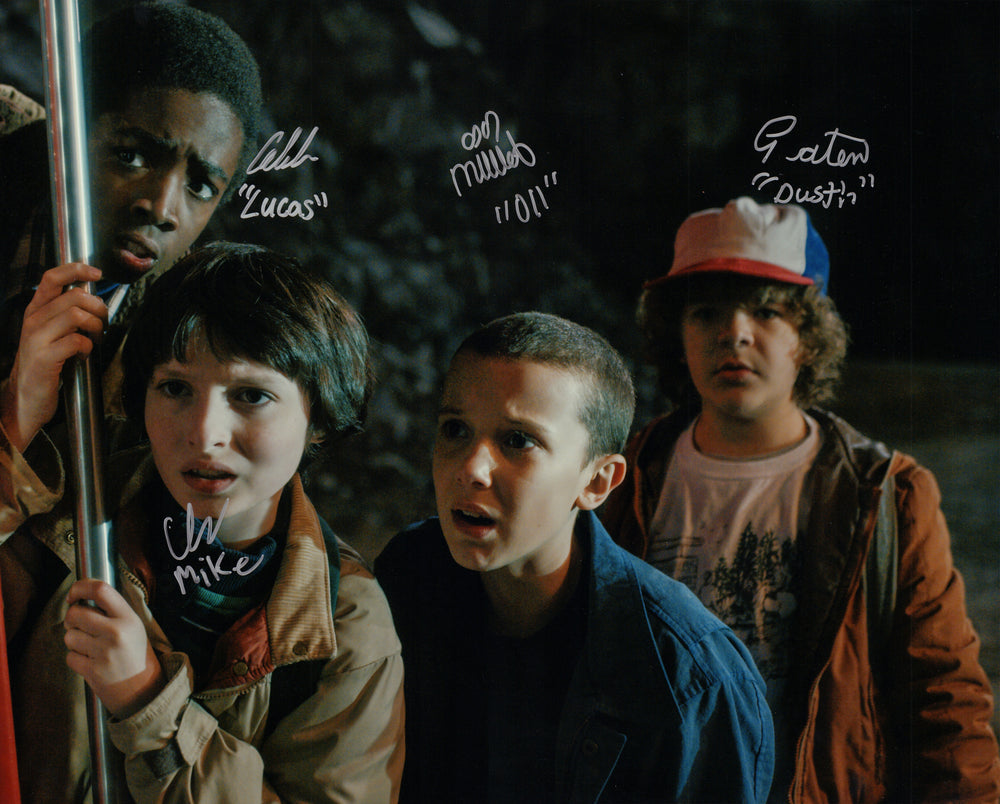 Millie Bobby Brown as Eleven, Finn Wolfhard as Mike, Caleb McLaughlin as Lucas, & Gaten Matarazzo as Dustin in Stranger Things Signed 16x20 Photo with Character Names