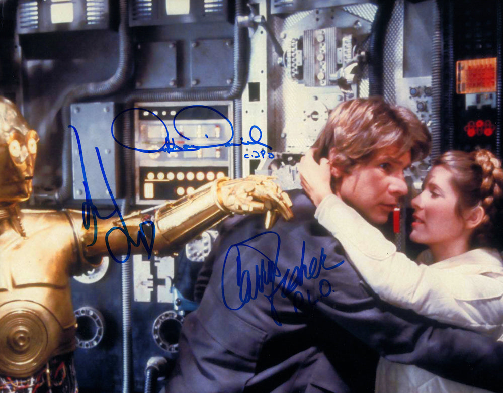 Harrison Ford as Han Solo, Carrie Fisher as Princess Leia, & Anthony Daniels as C-3PO in Star Wars: The Empire Strikes Back Signed 11x14 Photo