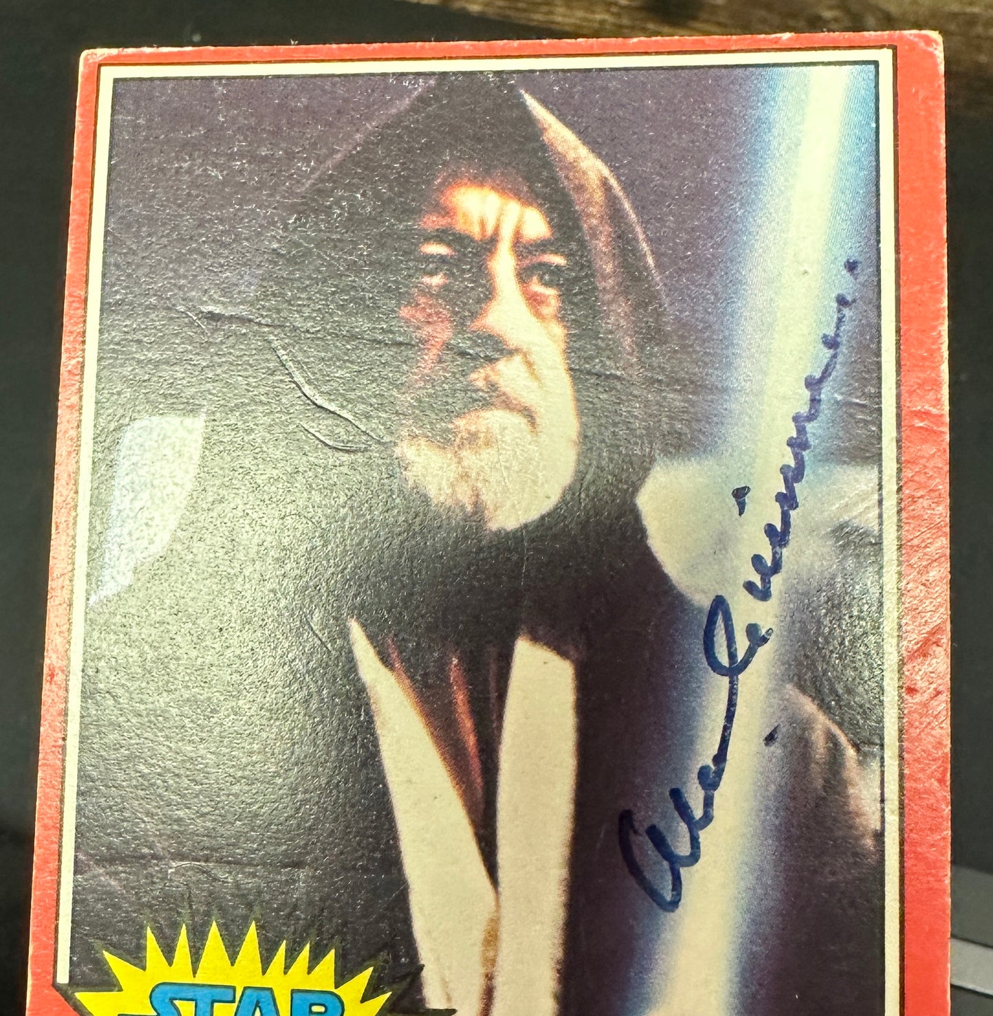 
                  
                    Alec Guinness as Obi-Wan Kenobi with Lightsaber in Star Wars: A New Hope Signed Topps Series 2 Red Trading Card
                  
                