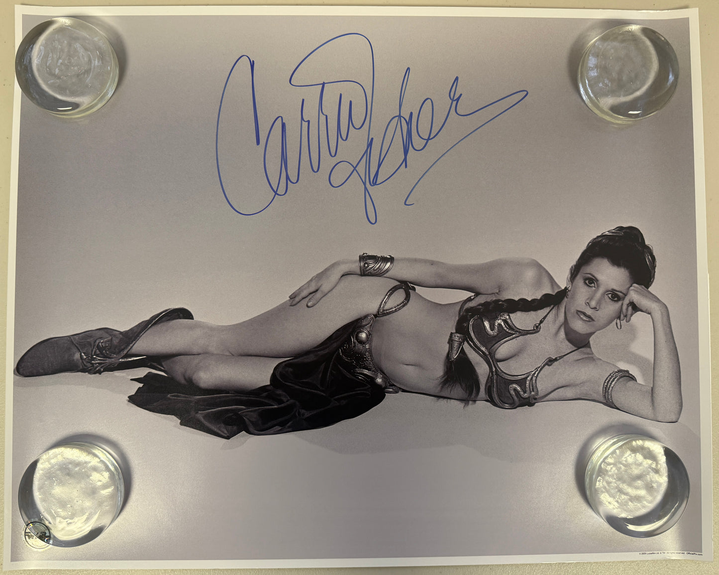 
                  
                    Carrie Fisher as Slave Princess Leia in Star Wars: Return of the Jedi (Official Pix) Signed 16x20 Photo
                  
                