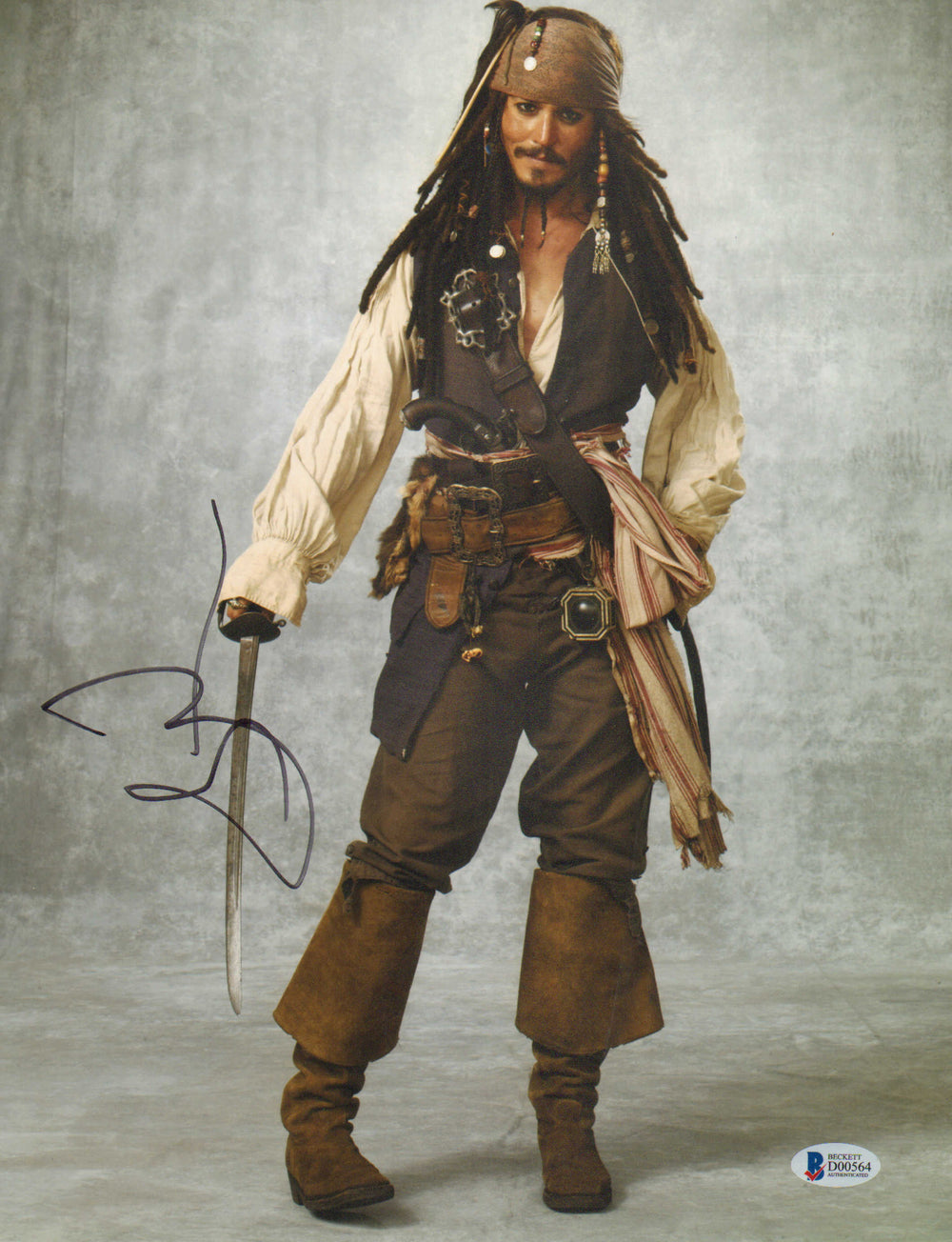 Johnny Depp as Captain Jack Sparrow in Pirates of the Caribbean (Beckett) Signed 11x14 Photo