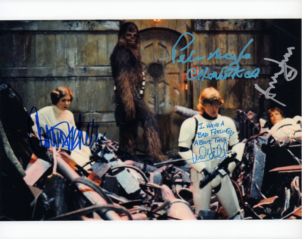 
                  
                    Harrison Ford, Carrie Fisher, Mark Hamill, & Peter Mayhew in Star Wars: A New Hope Signed 8x10 Photo with Hamill Quote
                  
                