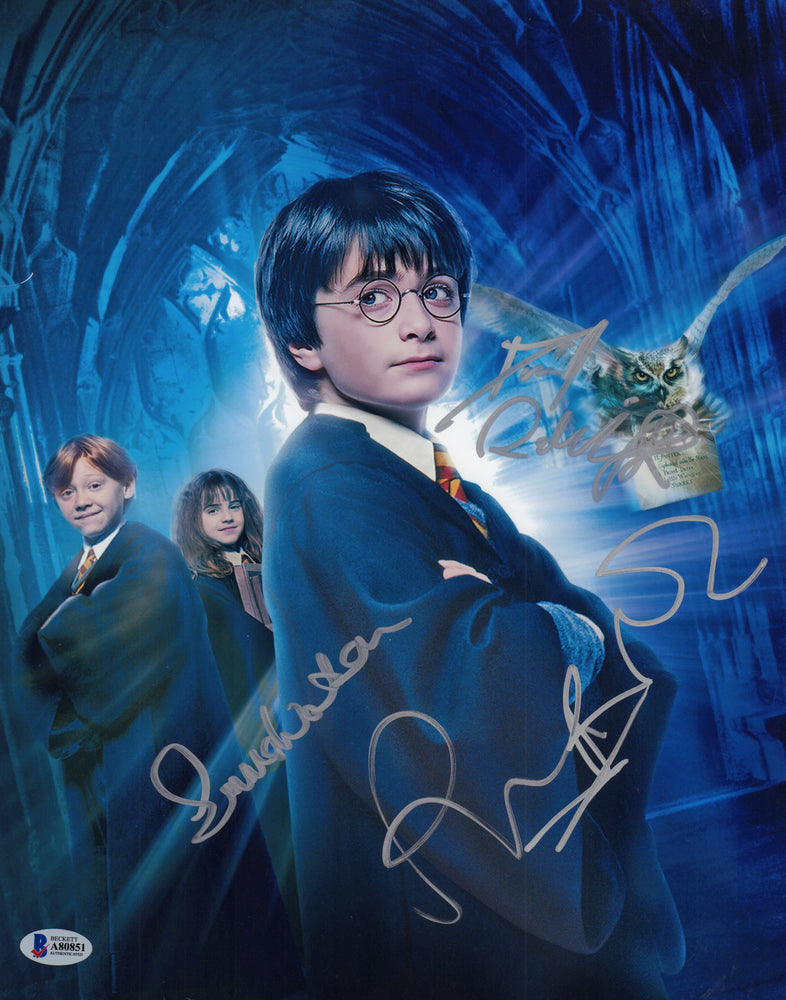 
                  
                    Daniel Radcliffe as Harry Potter, Emma Watson as Hermione Granger, & Rupert Grint as Ron Weasley from Harry Potter Signed 11x14 Photo
                  
                